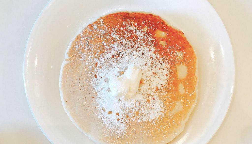 Short Stack Pancakes · (2) Pancakes Topped with Powdered Sugar, Syrup and Butter on the side.
