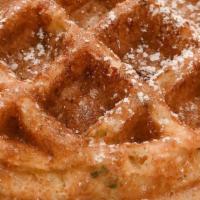 Corn Waffle · *Not Your Typical Corn Waffle, Topped with Powdered Sugar and Citrus Whiskey Syrup on the Side