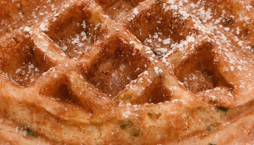 Corn Waffle · *Not Your Typical Corn Waffle, Topped with Powdered Sugar and Citrus Whiskey Syrup on the Side