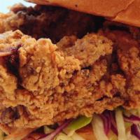 Fried Chicken Sandwich · Fried Chicken with House Coleslaw on Brioche Bun; Served with Choice of Side