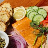 Smoked Salmon Board · Filet of smoked salmon. Served with sliced tomatoes, cucumbers, red onion, lemon, capers, di...