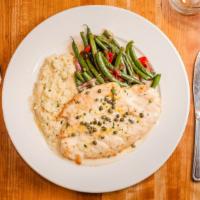 Chicken Piccata · Sautéed chicken scaloppini with lemon caper butter sauce, herbed risotto, and seasonal veget...