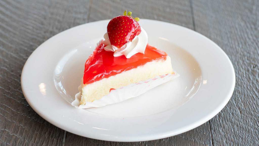 Strawberry Cheesecake · Smooth cream cheese base, swirled with strawberry preserves, all on a buttery graham cracker crust.