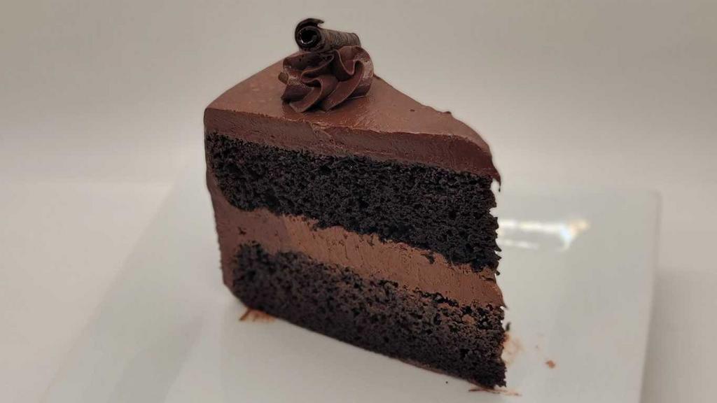 Double Chocolate Iced Cake · Layer of chocolate cake, rich chocolate frosting,and chocolate sauce.