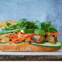 Chicken Banh Mi · Roasted lemongrass chicken with fried shallot mayo, pickled veggies, cilantro, cucumber, jal...