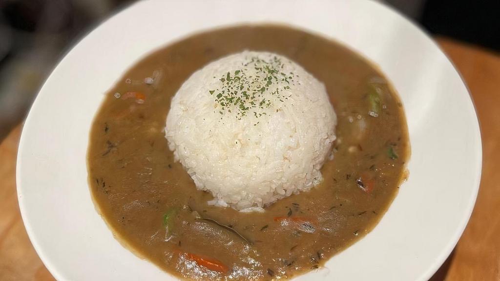 Gumbo · a southern Louisiana stew with hot link sausage (100% beef in pork casing), shrimps, turkey, okra and topped with a scoop of white rice.
