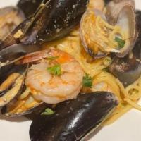 Seafood Pasta · spaghetti, peeled shrimps, clams, mussels, sea urchin cream sauce.