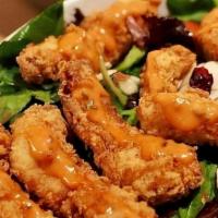 Fish Salad · C salad topped with fried fish fillets.