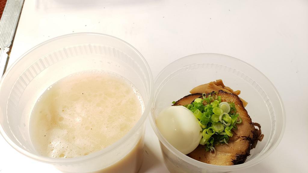 Tonkotsu Ramen · Japanese ramen served in pork-chicken broth topped with sliced pork, egg, bamboo shoot, green onion, mushroom***NOODLE PACK SEPARATELY***