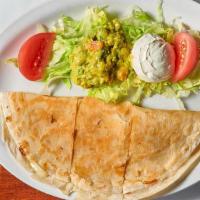 Quesadilla · A large soft flour tortilla with cheese and your choice of filling. served with guacamole an...