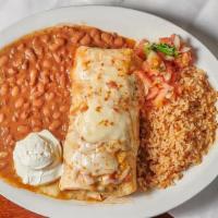 Chicken Burrito · A large flour tortilla filled with our specially seasoned chicken and charro beans covered w...