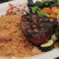 Filet Mignon · Filet mignon grilled to perfection! served with rice and vegetables.
