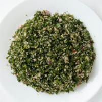 Tabbouleh Salad  · A zesty vegetarian salad of finely chopped parsley, tomatoes, green onions, cucumbers, bulgu...