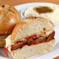 The Sausage Sandwich · W/ choice of grilled chicken or spicy smoked hot link. Topped w/ sautéed onions, sweet & hot...