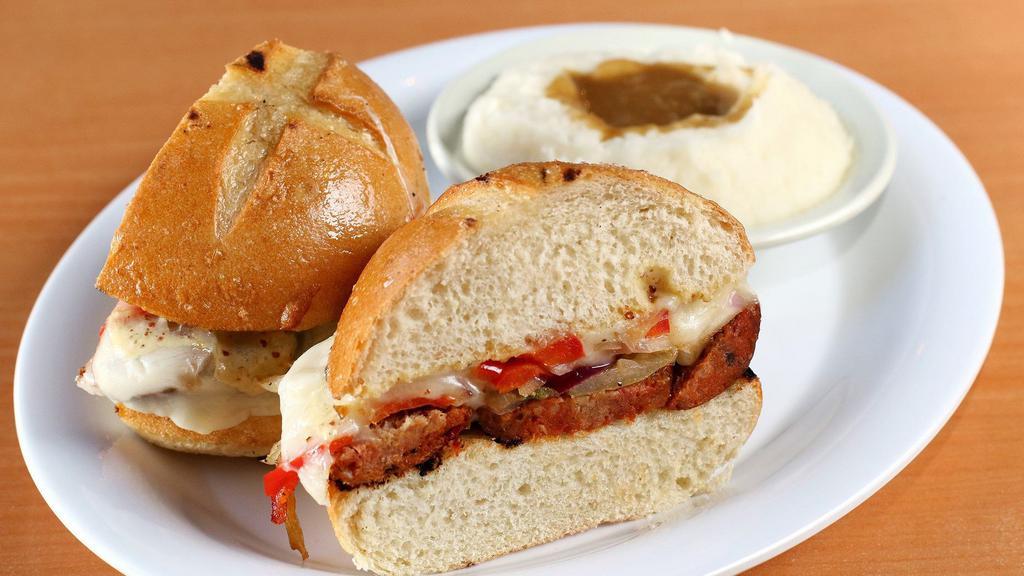 The Sausage Sandwich · W/ choice of grilled chicken or spicy smoked hot link. Topped w/ sautéed onions, sweet & hot peppers, provolone, & roadside whole-grain mustard-mayo sauce.