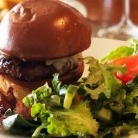 SG Cheeseburger · Naturally raised Niman Ranch ¼ lb beef patty with caramelized onions, served on a Brioche bu...