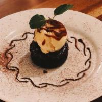 Chocolate Torte  · warm chocolate cake coated in a caramel sauce served with a scoop of gelato.