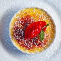 Creme Brulee · Rich sweet custard enveloped with caramelized sugar crust topped with berries