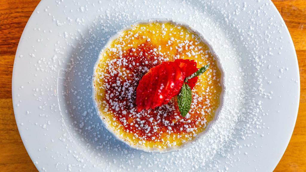 Creme Brulee · Rich sweet custard enveloped with caramelized sugar crust topped with berries