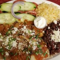 Chilaquiles Salvadoreños · Served with rice, beans, and salad.