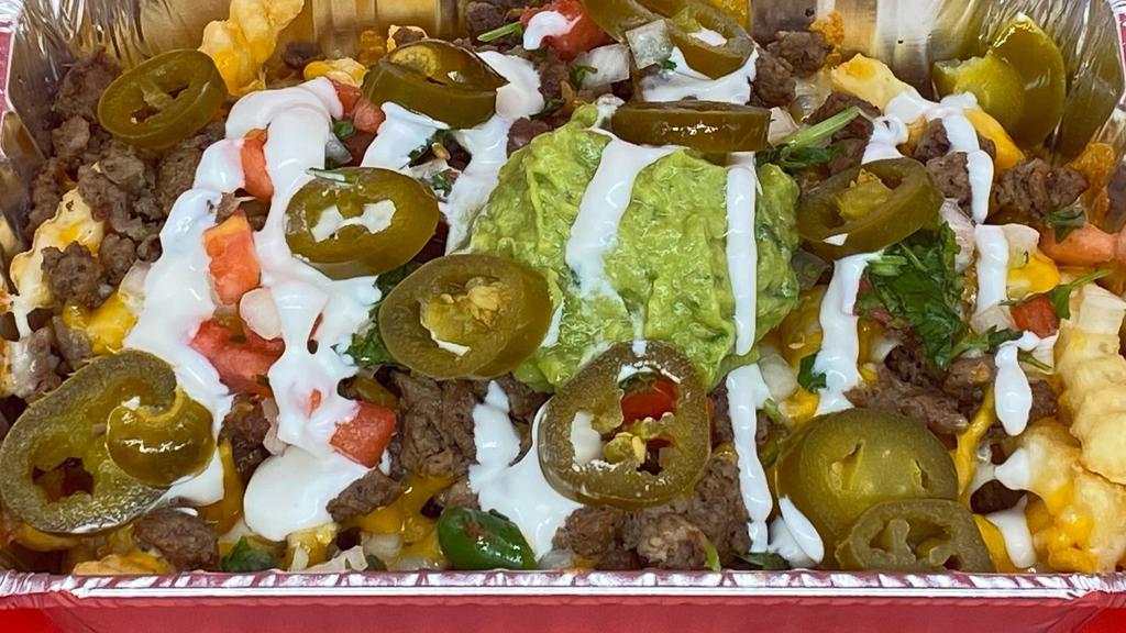 Asada Fries · Our Crisp French Fries with melted cheese, Guacamole, Sour Cream and Pico de Gallo. (Jalapenos may not alway be available)