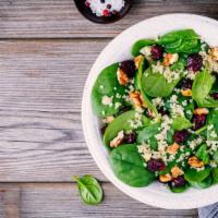 Cranberry Spinach Salad · Customer's favorite cranberry spinach salad with walnuts, feta cheese, and raspberry vinaigr...
