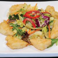 A-1. Fried Tofu Salad · Fried tofu tossed with mixed green salad with house dressing.
