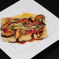 A-9. Pan Fried Firm Tofu · Pan fried tofu topped with sautéed assorted mushrooms and vegetables with special sauce.