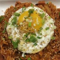 B-9. Kimchi Fried Rice · Stir in soy sauce kimchi and rice with spam topped with fried egg.