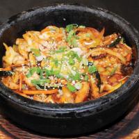B-1. Seafood Bibimbap · Seafood with mixed vegetable and fried egg over rice in a sizzling pot.
