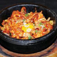 B-8. Spicy Squid Bibimbap · Spicy squid with mixed vegetable and fried egg over rice in a sizzling pot.