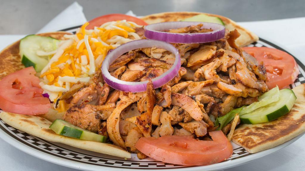 Small Chicken Salad · Chopped Grilled Chicken, Romaine & Iceberg Lettuce, Tomato, Cucumber, Grated Swiss & American Cheese (Has small amounts of Red Cabbage and thinly sliced Carrots.) Served With Pita Bread.
