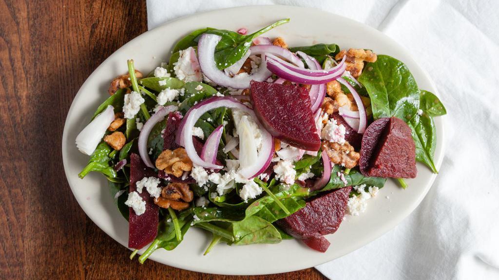 Spinach Salad · Spinach, beets, caramelized walnuts, red onions, Feta cheese and vinaigrette.