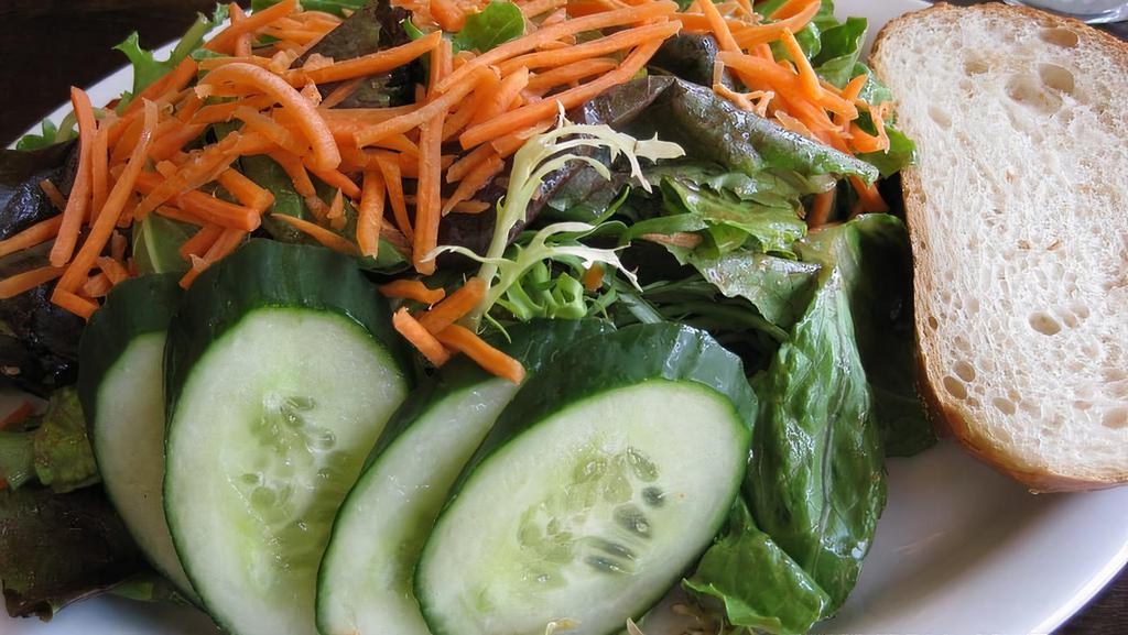 House Salad · Baby mixed greens, cucumber, carrots and tomato.