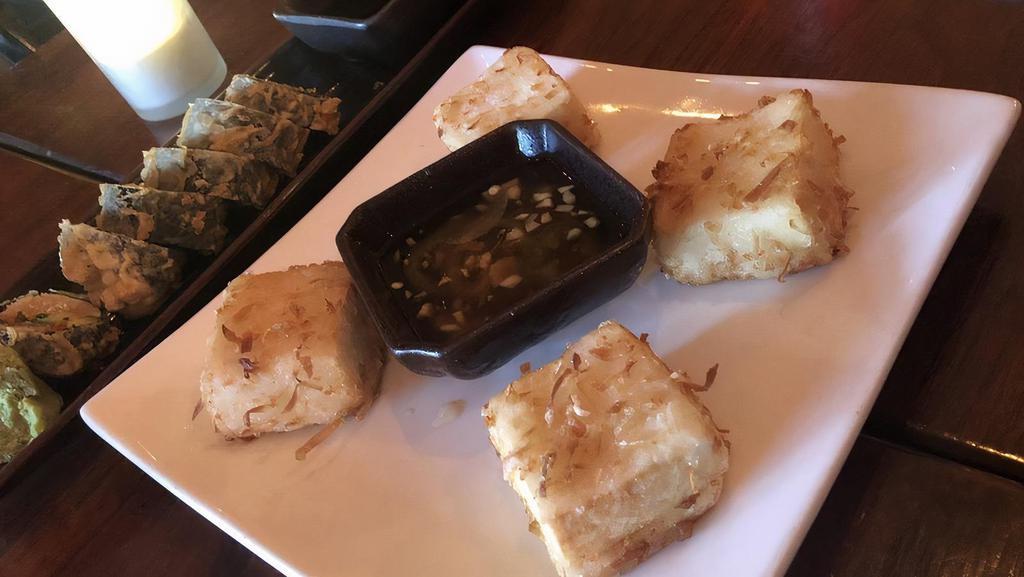 Coconut Fried Tofu · Served with a ginger-lime dipping sauce.