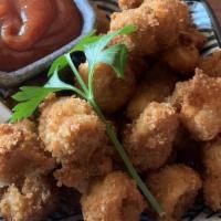 Fried Calamari · Lightly fried with seasoned bread crumbs with cocktail sauce.