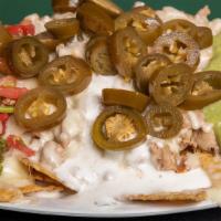 Super Nachos (Large) · Choice of meat, refried beans, cheese, sour cream, guacamole, jalapenos and pico de gallo.