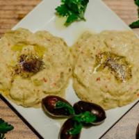 Baba Ghanoush · Chopped roasted eggplant dip, with fresh herbs, lemon juice, and olive oil.