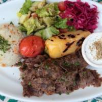 Lamb & Beef Gyro Plate · Slow cooked sliced marinated lamb and beef. Served with salad, rice, pita bread, and tzatzik...