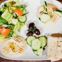 Hummus Plate · Garbanzo beans with garlic, lemon juice, olive oil, and tahini. Served with house salad and ...
