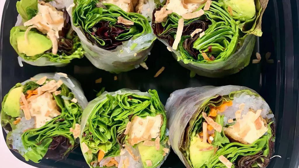 Salad in the Roll · Gluten free. Vegan-friendly. Avocado, toasted coconut, shredded carrot, bean thread noodles, red leaf, mint leaves, and a side of peanut sauce.