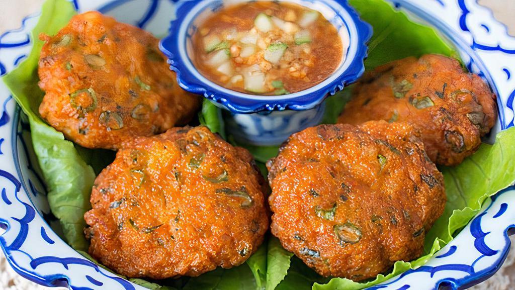 Fish & Curry Cake · Ground fish mixed with a house-made red chili paste, served with chunk cucumber in sweet chili sauce.