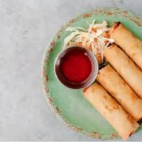 Spring Rolls · Vegetarian. Fried egg rolls served with sweet chili sauce.