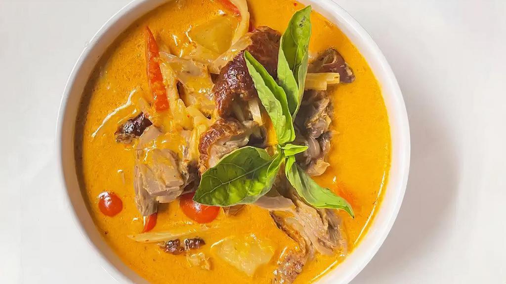 Pineapple Duck Curry · Gluten free. Roasted duck, thai eggplant, red bell, fresh pineapple, thai basil, bamboo shoots, carrot, thai red curry, and coconut milk.