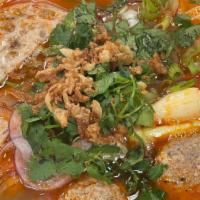 23. Bun Rieu (Pork and Crab Paste Soup) · Tomato, pork, crab paste, shrimp  w/vermicelli noodle.