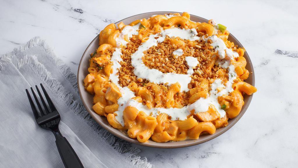 Buffalo Chicken Mac · All of the flavor with none of the mess. Grilled chicken, sharp cheddar, jack cheese, scallions and buffalo sauce. Topped with crispy breadcrumbs and homemade ranch. Contains gluten, dairy, and nightshades. We cannot make substitutions.