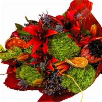 Cortona · Winter seasonal arm bouquet with deep red tiger lilies, protea, green moss, curly willow, bl...