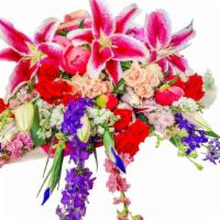 Love in Pink · Arm bouquet with stargazers, iris, delphinium, roses, larkspur and peonies.