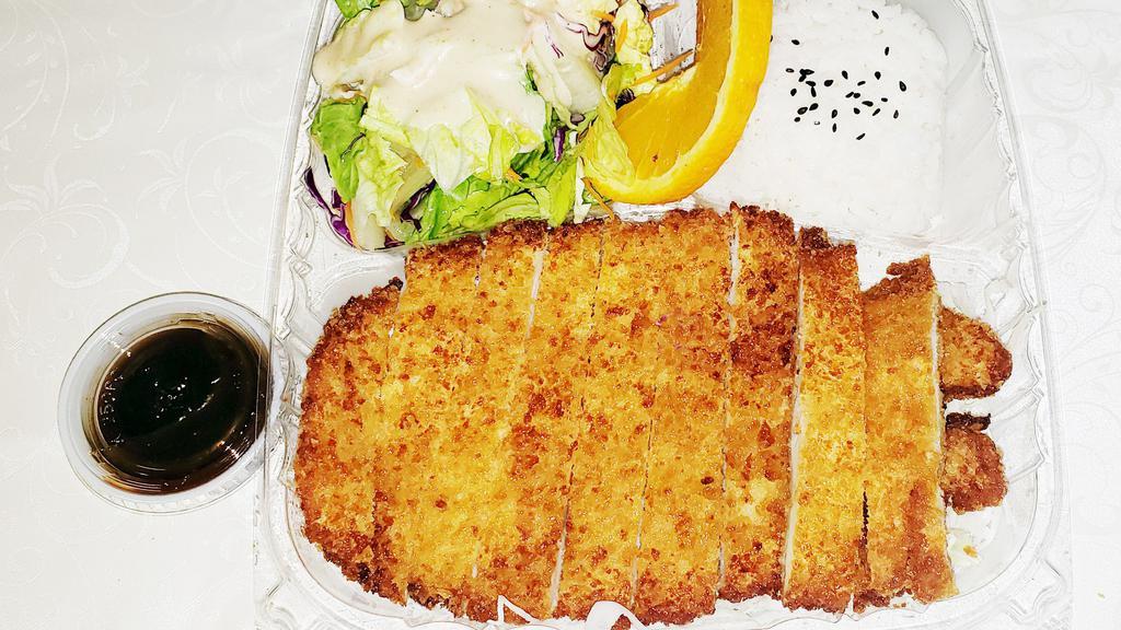 Chicken Katsu · Breaded, deep fried chicken breast cutlets with salad and rice.