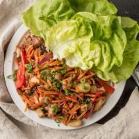 Asian Chicken Lettuce Wraps · Asian-style chicken and vegetables cooked to perfection with a side of crispy lettuce.